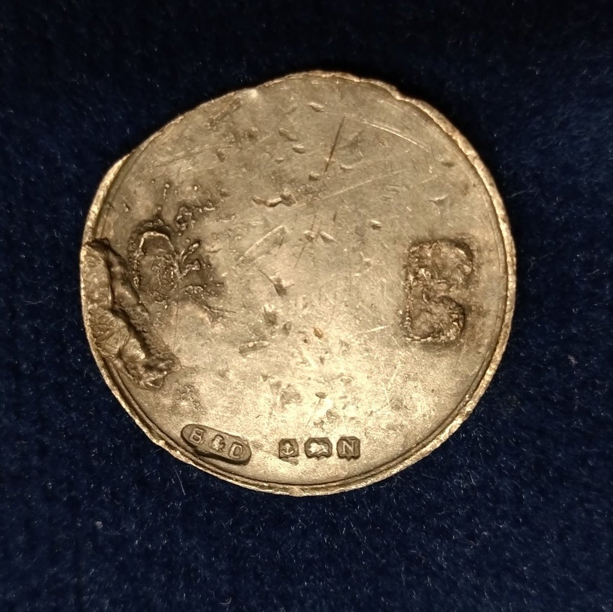 SDetectorist's tweet image. Best bits from tonight.
Silver disc, Hallmarked 1937.
Possibly a brooch as remains of fixing solder on back. No idea what was going on with the front.
A ship halfpenny, date illegible
Horse brass
Piece of worked bronze, perhaps medieval.