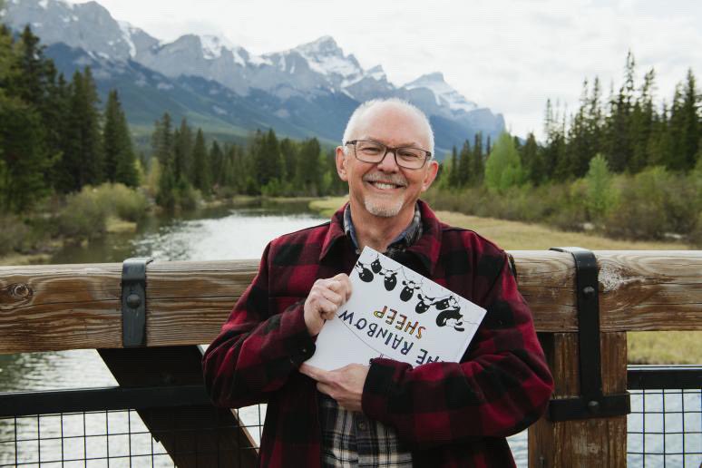 Author of “The Shack” Paul Young having fun with my new kids book “The Rainbow Sheep”.