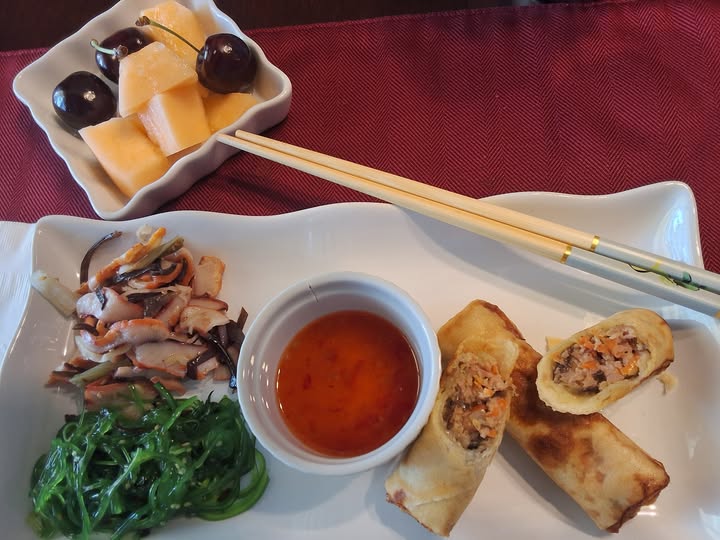 Tonight, Asian night, Tako and seaweed salad, Vienamese pork egg rolls with sweet chili dipping sauce and fresh melon and cherries.