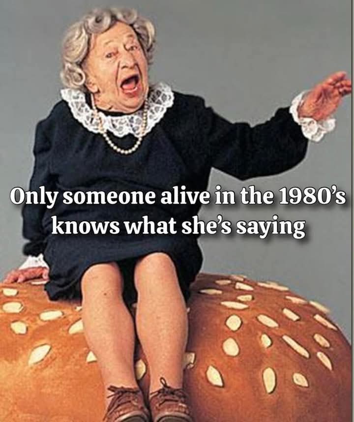Ok y'all... what is this old lady sitting on top of a hamburger bun saying ??? She looks upset.