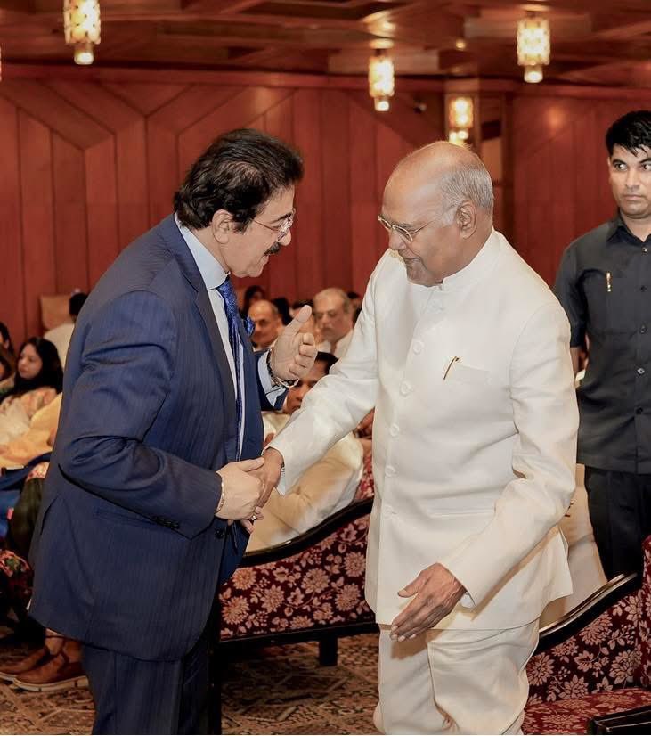 Receiving the divine blessings of Shri Ram Nath Kovind Ji, the 14th President of India, during a spiritual program held at Hotel Ashok.