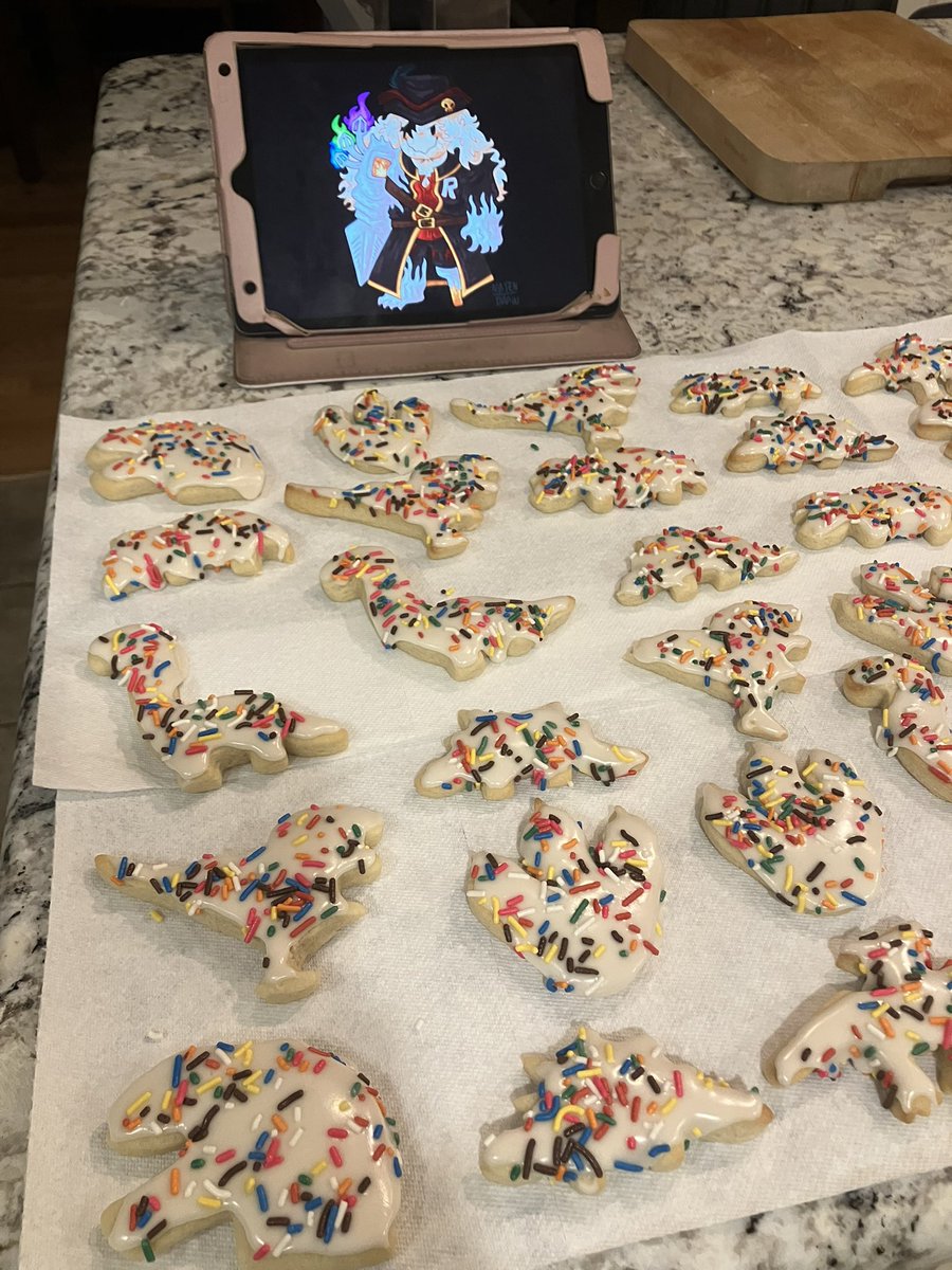 ninten_draw's tweet image. Me showing my frosted dinosaur cookies pictures of gasharpoon John Doe so the icing can harden faster