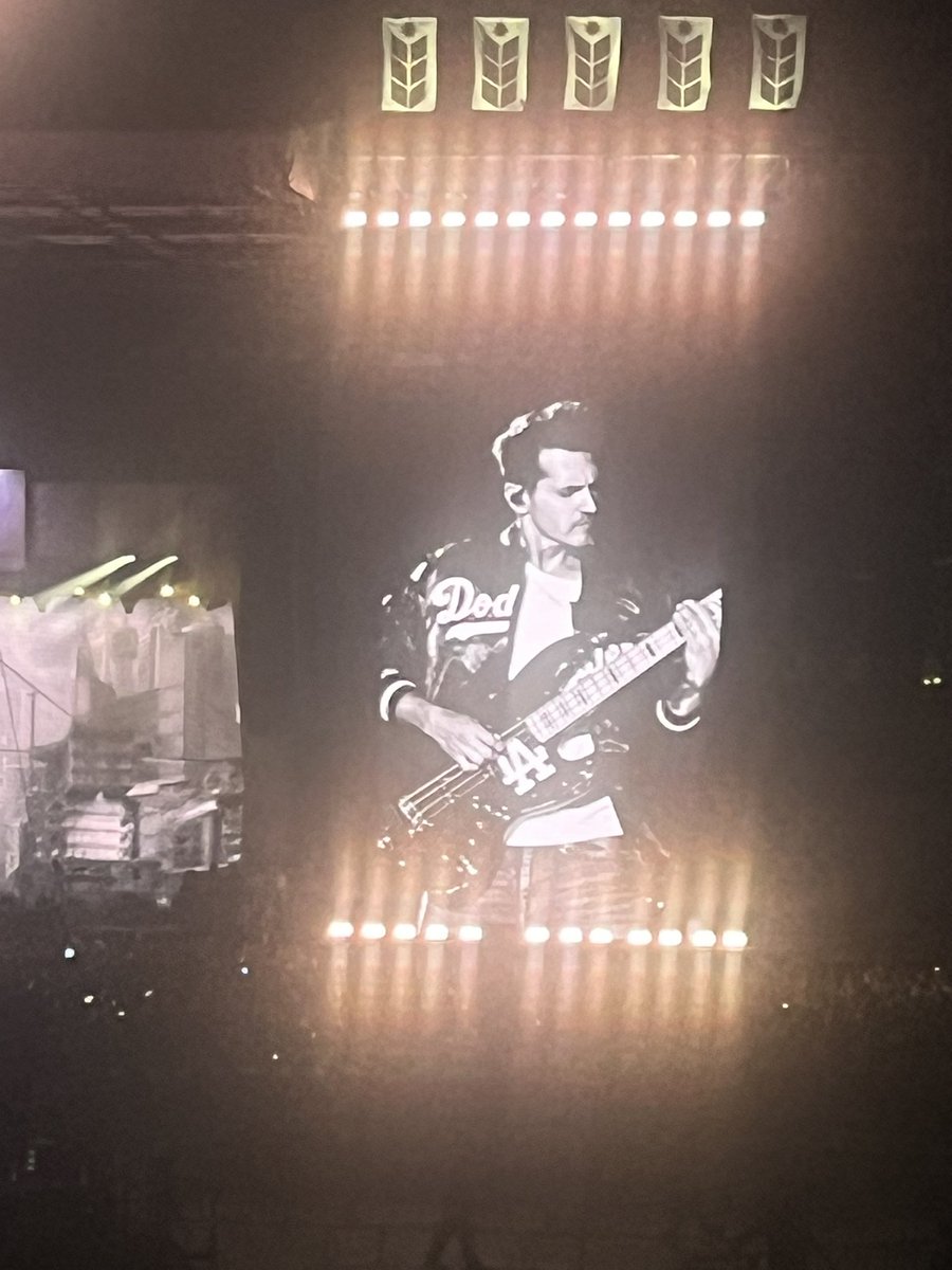 Klein25's tweet image. Hell yeah @mikeyway of My Chemical Romance rocking the Dodgers jacket and bass guitar in Los Angeles.