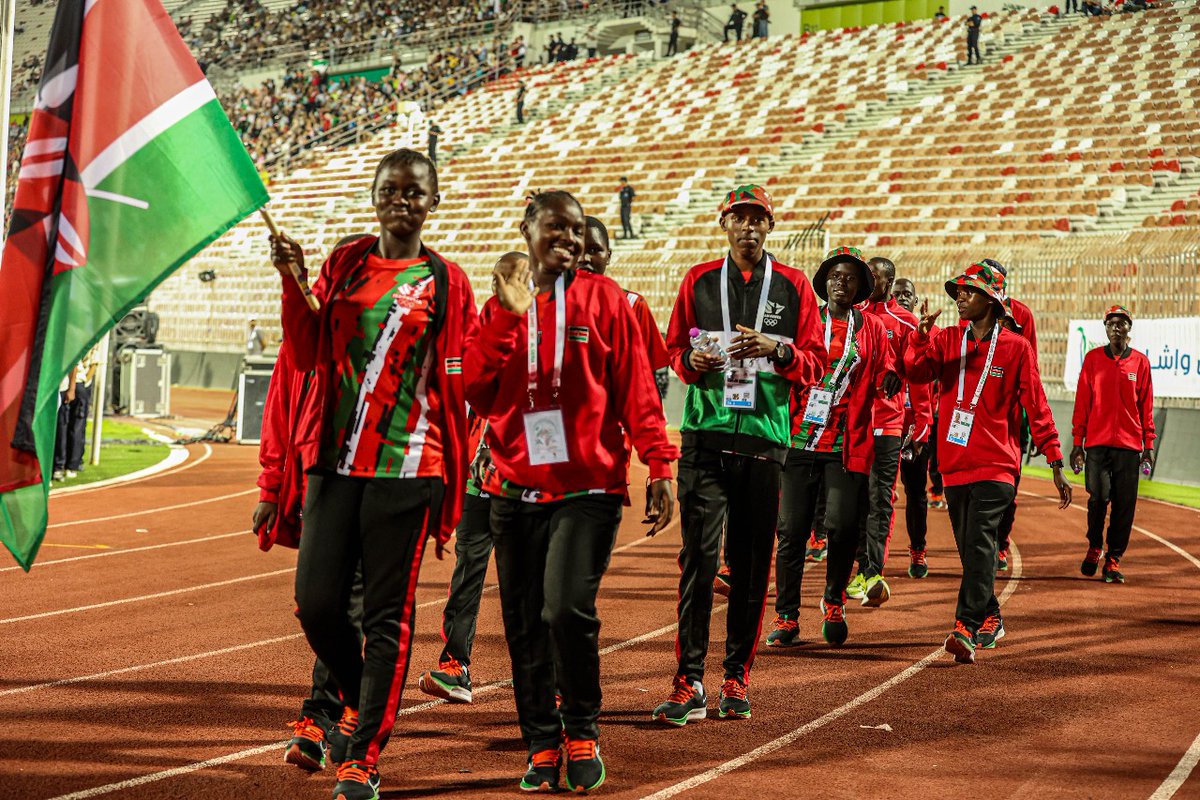 KenyaBoxing's tweet photo. Flagbearer Sonia Atieno leads the Kenyan team at the opening ceremony of the inaugural African School Games at the 19 May 1956 Stadium, Annaba. 

Sonia Atieno and 13-year-old Lukeman Shaffi will be representing Kenya in the sport of boxing, which is among 25 sports at the event. https://t.co/X2CKxrL9h7