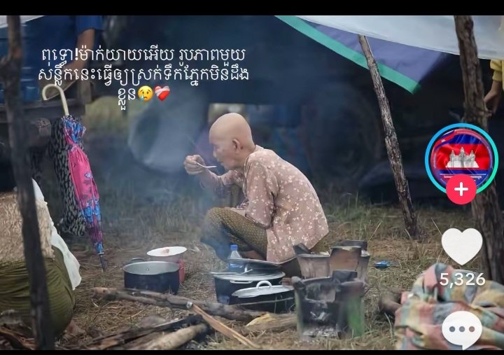 Her dress and look reminds me of my late grandmother...old woman in the shelter is eating food. Many people have evacuated from their homes after the armed clash at the border...