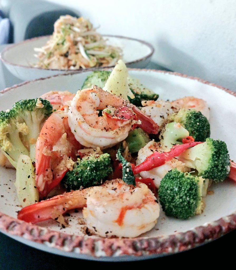 Kimchi salad and garlic chilli butter prawns with. broccoli