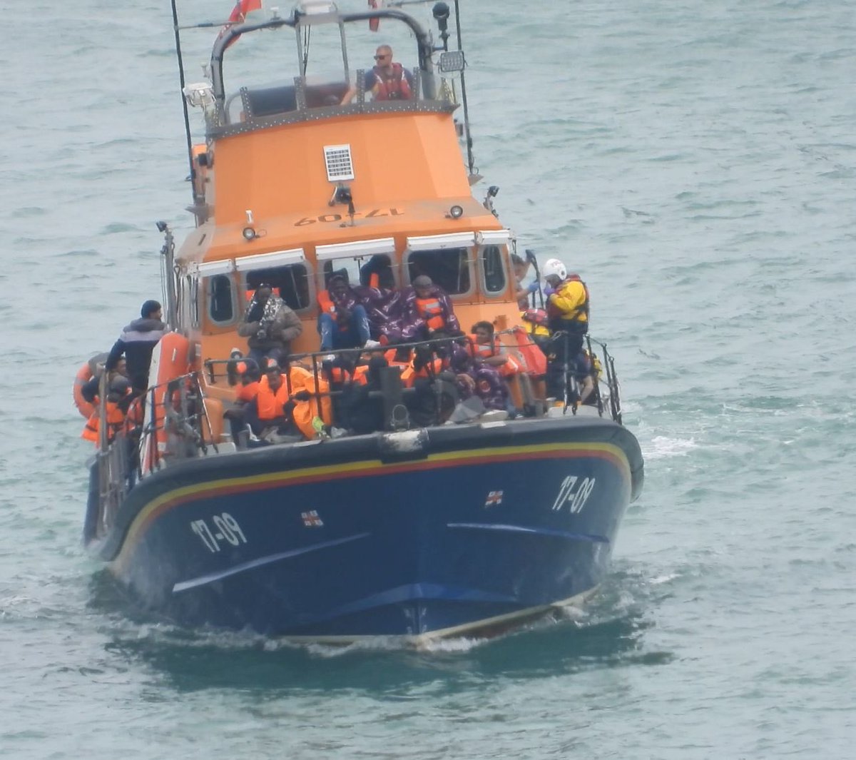 122 migrants in two boats were brought to shore at Dover yesterday. One man died attempting the crossing.