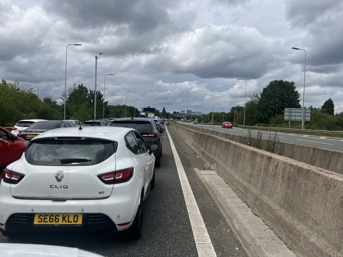 Accident M60 Leeds-bound north of Urmston. All lanes closed since about 13.30