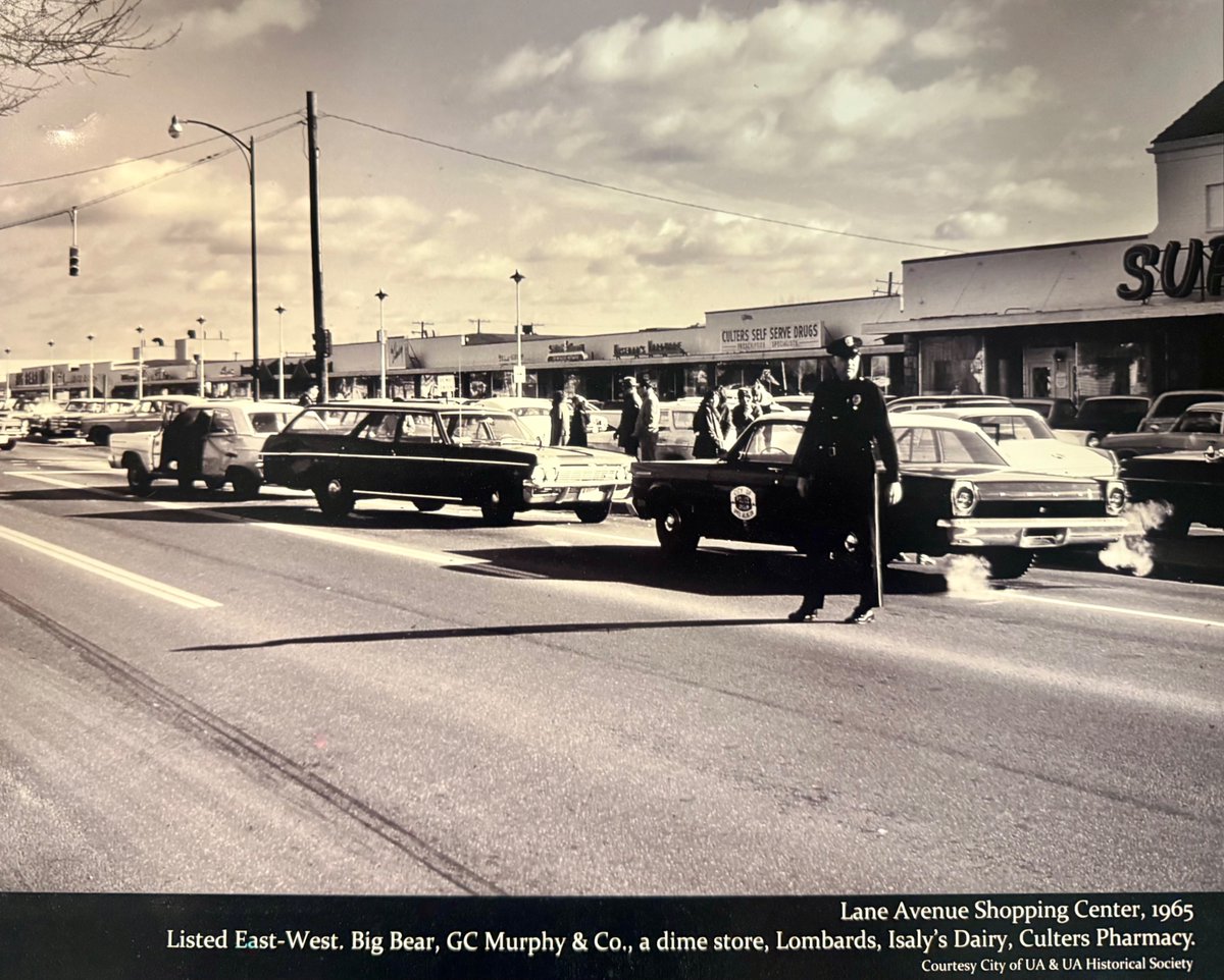 A 60 year-old traffic incident with a very different-looking Lane Shops in the background. Drive safely out there!