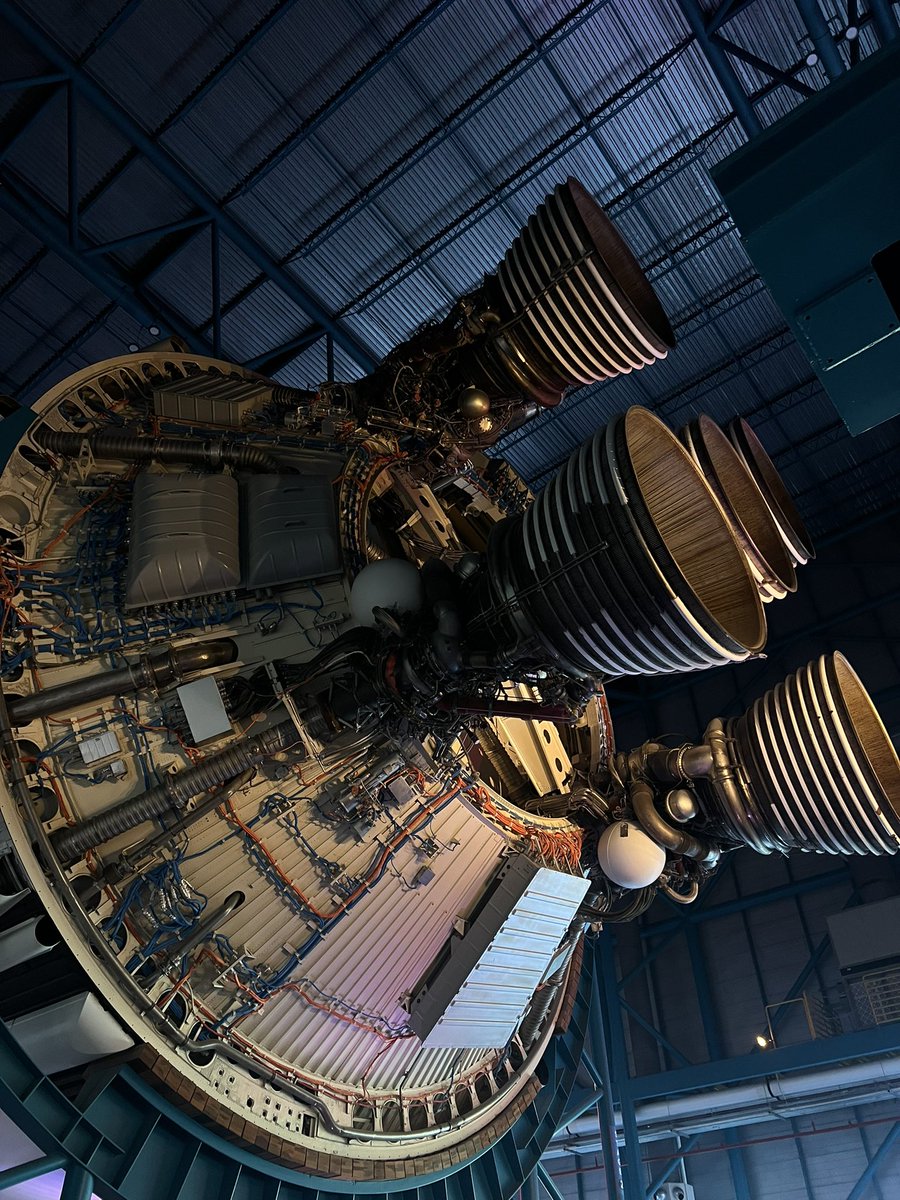 eigenron's tweet image. throwback to when i was literally right next to a fucking Saturn V!
those f-1 engines are the sexiest things i’ve seen in a hot minute.
the second picture is the stage-2 boosters, not the f1’s.