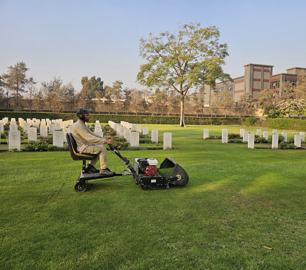 Despite the high temperature today, 39 degrees, I continue my work mowing the grass in the new Heliopolis cemetery. <a href="/CWGC/">Commonwealth War Graves</a> <a href="/AAPAComms/">AAAComms</a>