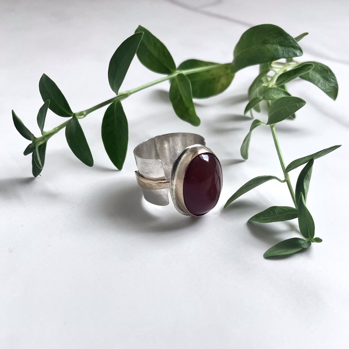 Are you a fan of statement rings?  This pretty bauble definitely qualifies.  The carnelian is a warm burnt umber color. The mixed metal band makes it more versatile.  I hope to have her listed in my “Beautifully Bold Collection”, hopefully this week.  bellarosejewelrydesign.com