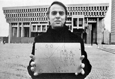 VitruviusGrind's tweet image. Carl Sagan with the Pioneer plaque outside of Boston City Hall.
