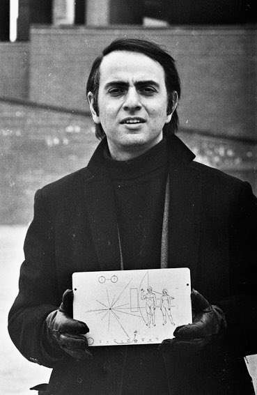 VitruviusGrind's tweet image. Carl Sagan with the Pioneer plaque outside of Boston City Hall.