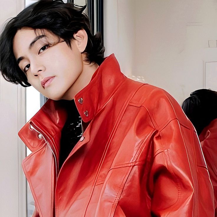 Taeveurr's tweet image. The first, cloaked in a fire-red jacket like a comet streaking across a midnight sky, exudes the aura of a starboy, untouchable, electric, a pulse in the dark that sings of rebellion and allure. The second, adorned in embroidered elegance, stands like a royal prince carved from