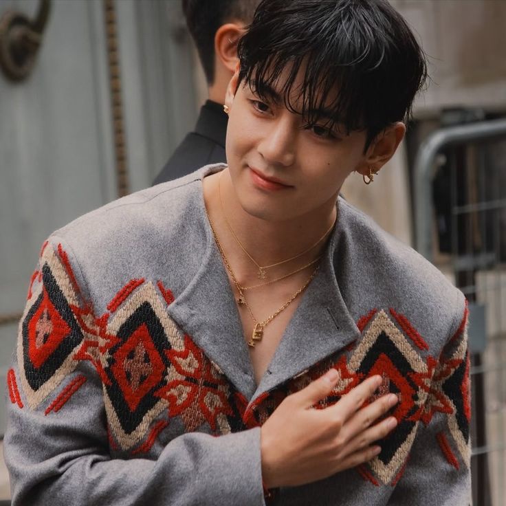 Taeveurr's tweet image. The first, cloaked in a fire-red jacket like a comet streaking across a midnight sky, exudes the aura of a starboy, untouchable, electric, a pulse in the dark that sings of rebellion and allure. The second, adorned in embroidered elegance, stands like a royal prince carved from