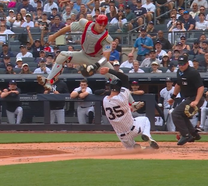 Do you guys understand how unbelievably impressive it is not only to jump this high as a catcher but ALSO apply the tag too