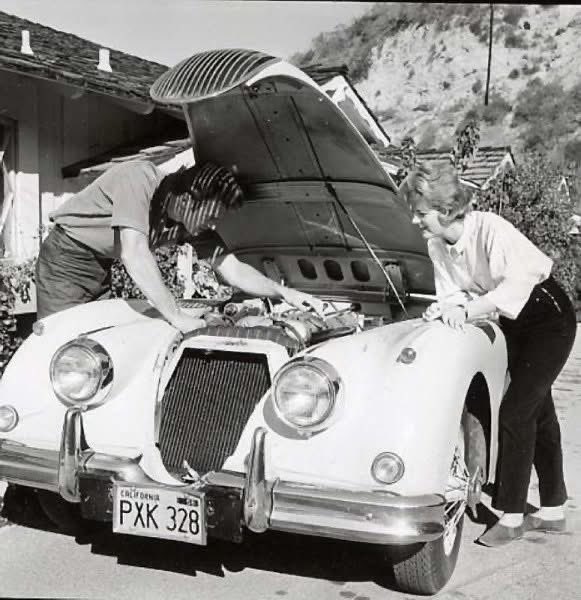 JagmansM's tweet image. Clint Eastwood with his Jaguar XK150, at his home in Sherman Oaks, Los Angeles, CA - 1961