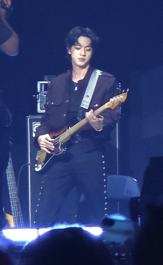 in a parallel world seokjin is the bassist, lead vocalist and front man of a rock band.