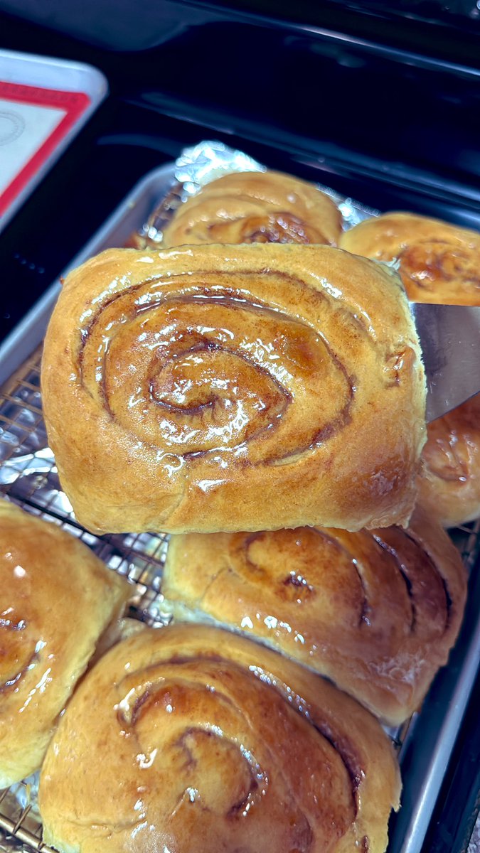 _donutninja's tweet image. And that’s a wrap on my full day of baking! Sourdough honey buns are finished and cooling down. Spirals aren’t as tight as I would have liked. This was the softest dough ever. I will increase the amount of flour a bit next time. They were a booger to roll up.