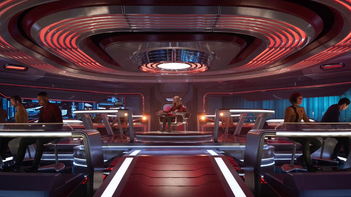 Modern Star Trek bridge sets are so confoundingly garish and ugly, they are almost aesthetically hostile and anxiety inducing. This looks like a group of miniscule people trapped inside an electric toastie-grill