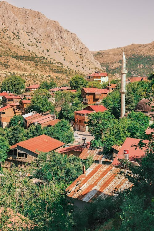 giminitop10's tweet photo. Scenic View of Mountain Village with Minaret https://t.co/J0SSTKPq5E