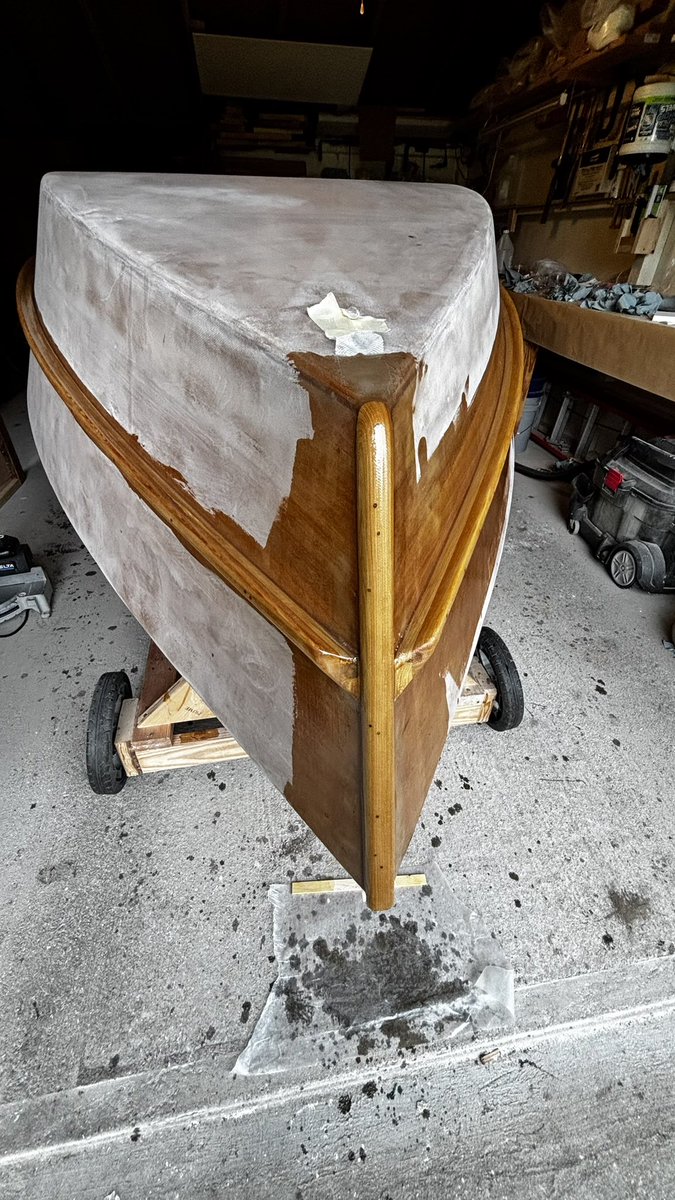 I finished applying fiberglass to the starboard spray rails. This completes the fiberglass wetting on the hull. A little bit of sanding and she will be ready for the universal epoxy primer.