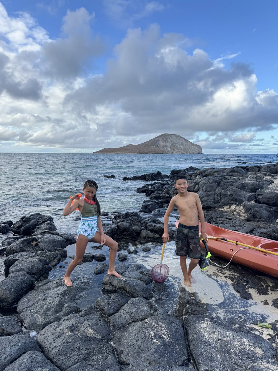 Never turn your back to the ocean, except when your dad wants to take a picture