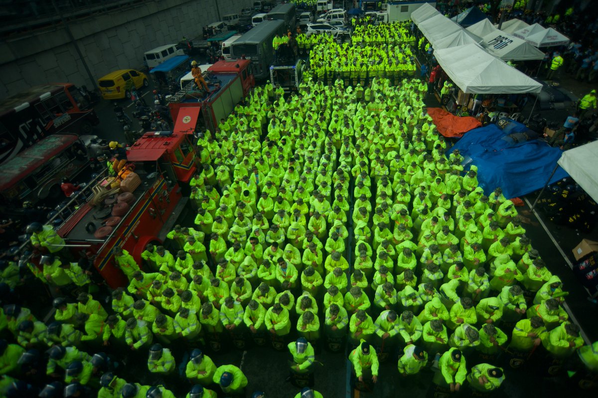 LOOK l PNP personnel in rain gear are posted along Commonwealth Ave. for the SONA. PNA photo by Ben Pulta . <a href="/pnagovph/">Philippine News Agency</a>
