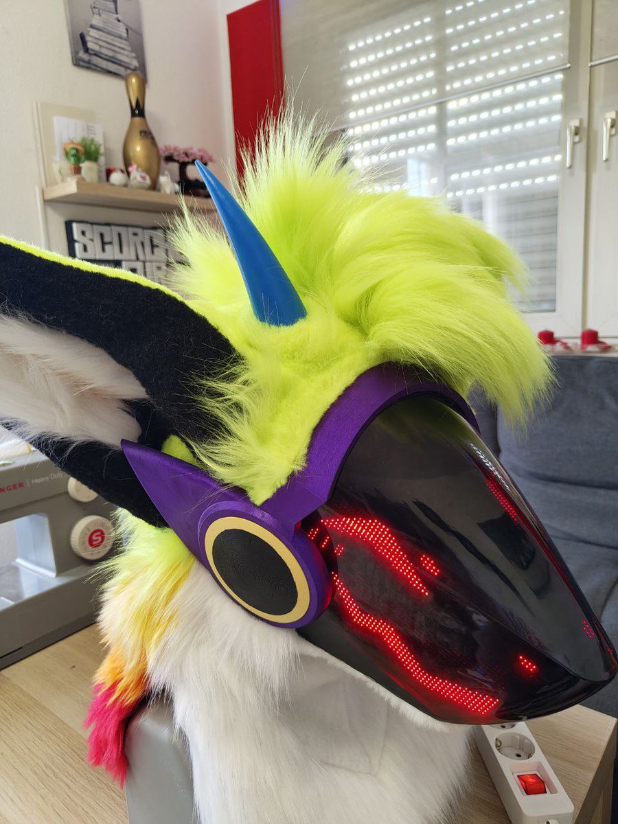 TinyKobl's tweet photo. I just finished my first Protogen head!
I really like how it turned out!

The face is static, but it comes with an app to customize the display!
The hair is made from individual strands and can be flung around and styled!
Horns are 3D printed!

Visor base by JFrandomness on Etsy! https://t.co/h4x3VpRhx3