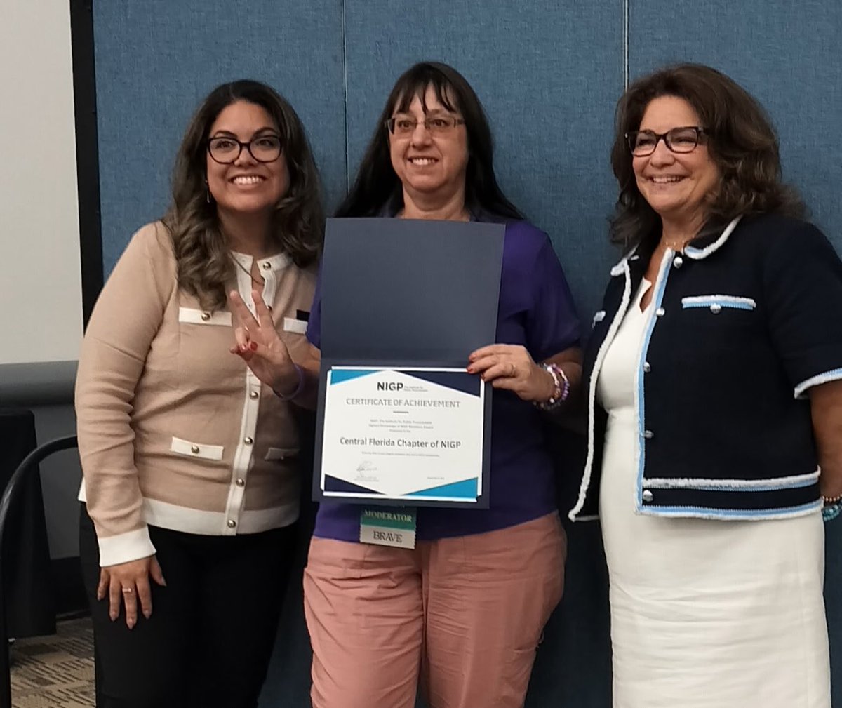 Chapter President Tabatha Freedman Highsmith proudly accepting recognition at the <a href="/OfficialNIGP/">NIGP</a> 2025 Forum.