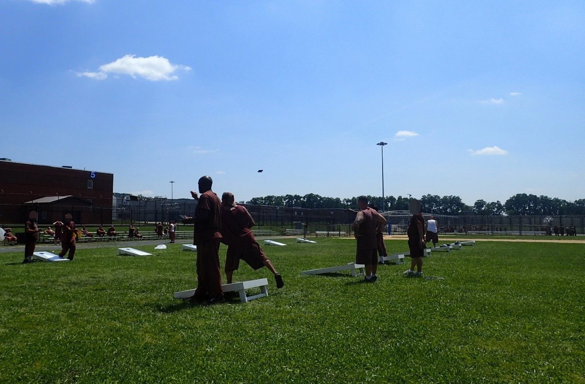 CorrectionsPA's tweet image. To celebrate Independence Day, the SCI Camp Hill Activities Department hosted a cornhole tournament where incarcerated individuals could showcase their skills and sportsmanship. More than 100 inmates enjoyed an afternoon outside as they competed in a single elimination doubles…