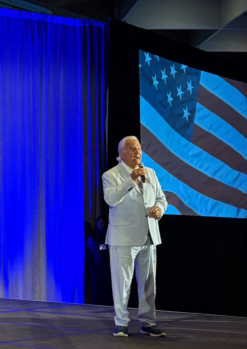 NARUC's tweet image. Hon. Bubba McDonald (Georgia) went on stage to open the first general session singing the song “God Bless America.”