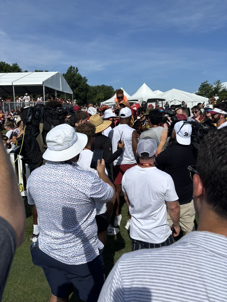 Terry McLaurin (with agent Buddy Baker standing behind him) is back at Commanders practice signing autographs.