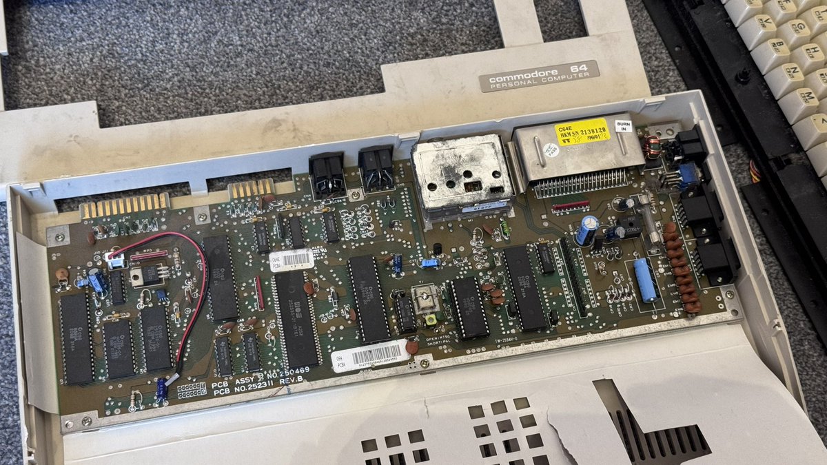 GeezerD205's tweet photo. Got given this poorly C64 as part of a deal on some other bits.

Looks like the board is fully populated and I’m sure I have spare keyboard parts, so I have hopes of a resurrection!

Sticker on the back says C64E - odd…

#Commodore #C64 #Commodore64 https://t.co/RH9dBkbkr5