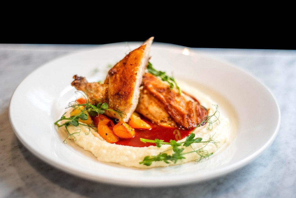 Our chefs have outdone themselves...again! 👨🏻‍🍳

The new, hearty Roasted Chicken on our menu is accompanied by Hominy Purée | Guajillo Reduction, and Carrots. 🍗🥕

Try this dish out for lunch at CIRC or dinner in The Bar at The Madison Concourse Hotel. 🍽️😋

#madisonwi #foodie