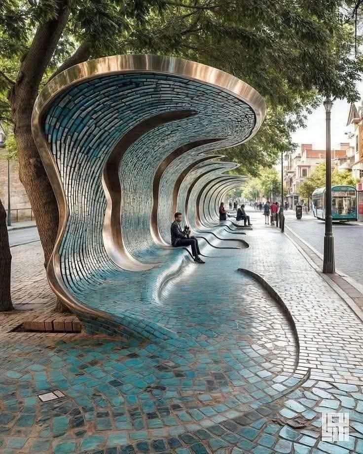 TreeHouseReal's tweet image. This is one of the world's most spectacular tramway stops in Seville, Spain: a wave-shaped structure, entirely covered in turquoise mosaics and polished steel.