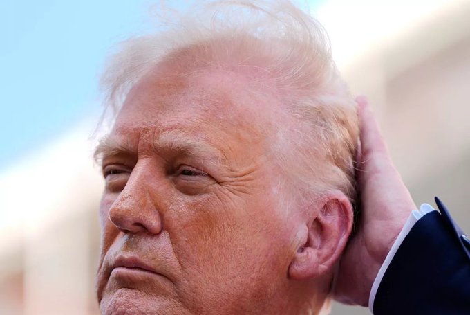 PHOTO CAPTURES DON'S CHROME DOME...