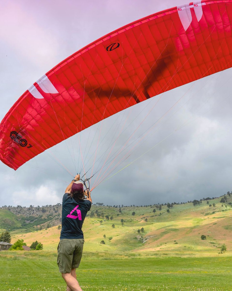 It's #MagentaMonday! And we're showcasing #TeamAmpacity doing cool things in their company swag. If you're in need of a pick-me-up, here's our Senior Manager of Software Engineering Matt Elliott getting ready to take to the skies paragliding just outside Boulder, Colorado.