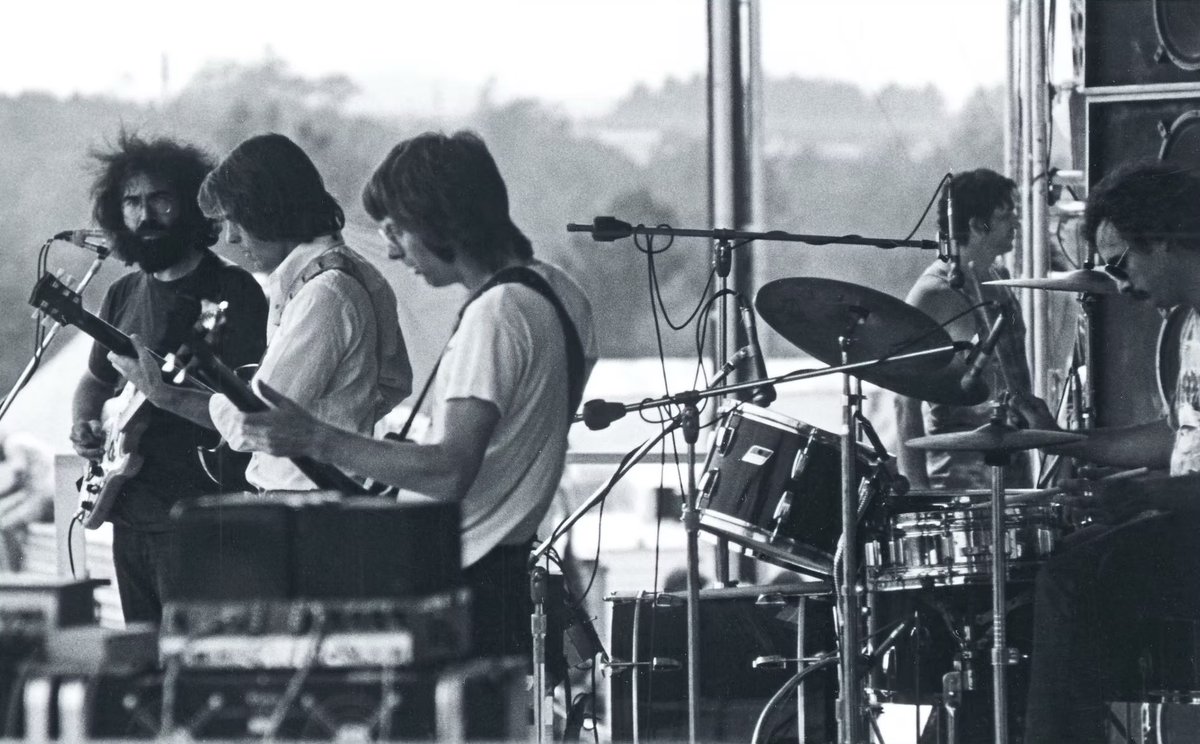 GratefulDead's tweet photo. On this day in 1973, nearly 600,000 people gathered at the Grand Prix Race Course in Watkins Glen, New York for the Summer Jam, a one-day festival featuring the Grateful Dead, The Allman Brothers Band, and The Band. Gates opened the day before for camping, and for just $10, fans received parking, a place to camp, and a full day of music. When it was their turn to take the stage, the Dead played two long sets, opening with “Bertha” and closing with an encore set that included Merle Haggard’s “Sing Me Back Home.”

Photos by @jplaffont, @EventideAudio, @summerjamfilm, and Louis Welch