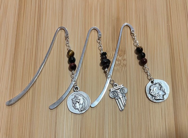 I’m Meg, a PhD researcher in Classics. I sell handmade jewellery inspired by my love of the ancient world using replicas of genuine Greek and Roman coins. All sales help support me AND you get to own a beautiful thing! #ClassicsTwitter ko-fi.com/agameganon/shop