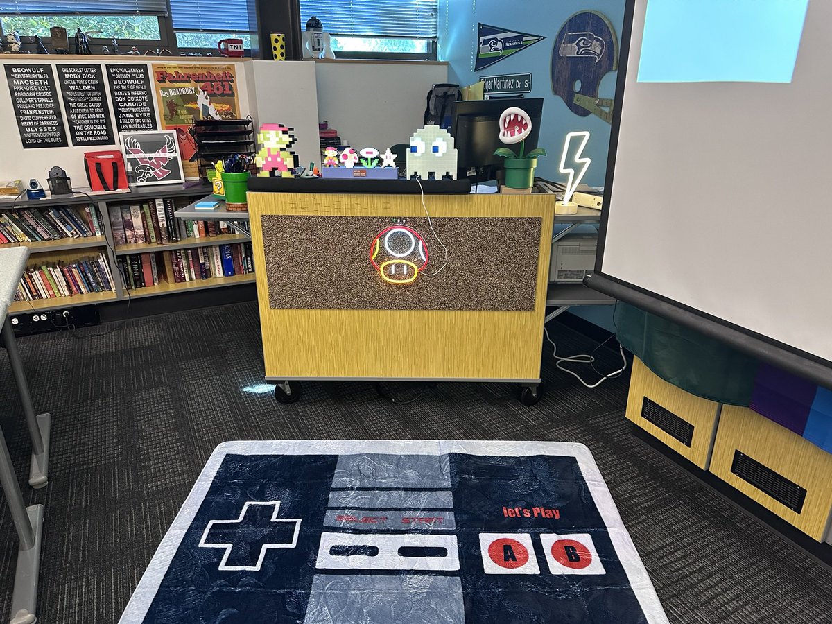 Modeltrainfan74's tweet image. Hello everyone. Attached is my #clearthelist2025 #ClearTheLists2025 link for this year. Most everything on my list is to establish an 80’s theme game area for stress relief. The other pic is my current classroom (big shelf to the left to hold the table top games/neon sign).…