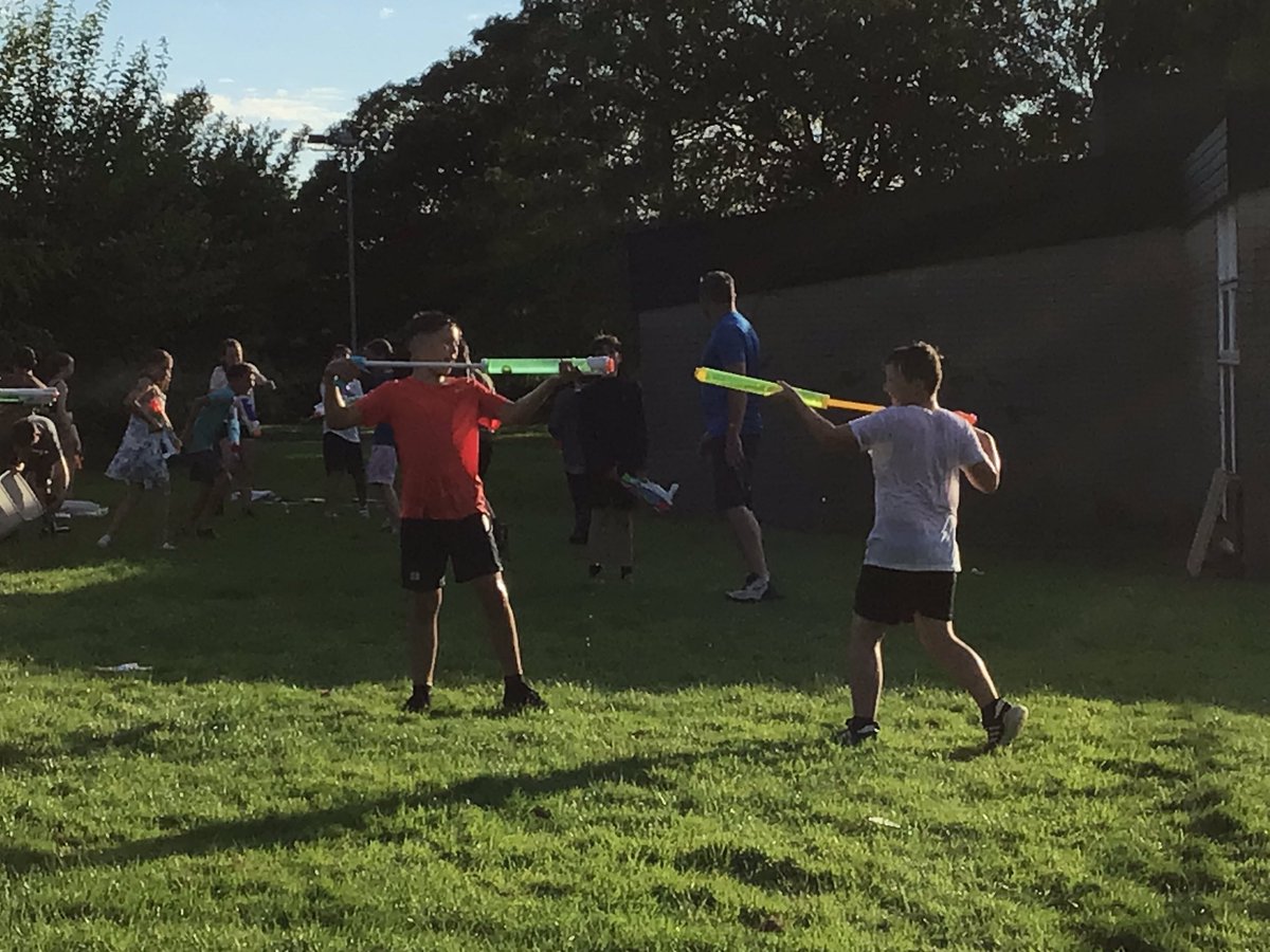 A fun end to a busy day, a party and water fight on the field!