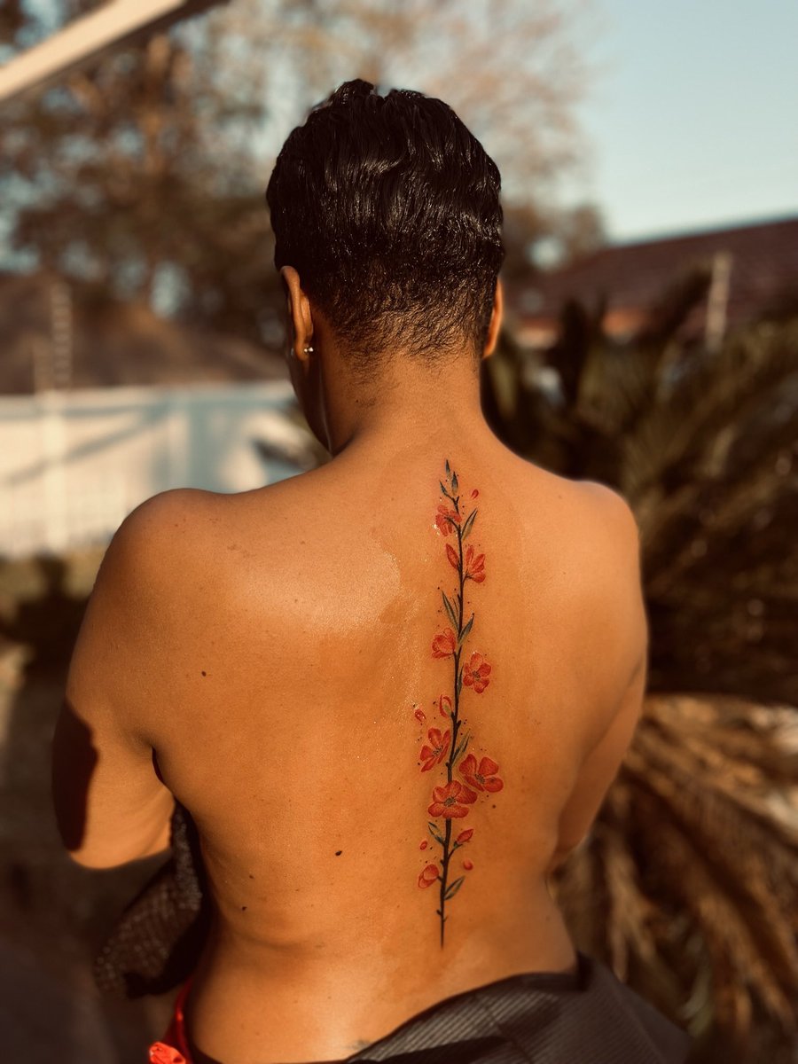 IZIMBALI - Neat beautiful floral spine TATTOO. Done by INKBOY QUE ✅