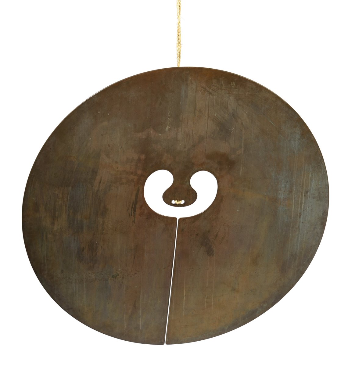 This bronze 48" gong, has a slit down the middle, which effectively makes it a longer slab, increasing vibrations and changing the sound. The cord by which it hangs is perfectly balanced, carefully configured. The monotype show several other possible gong shapes.