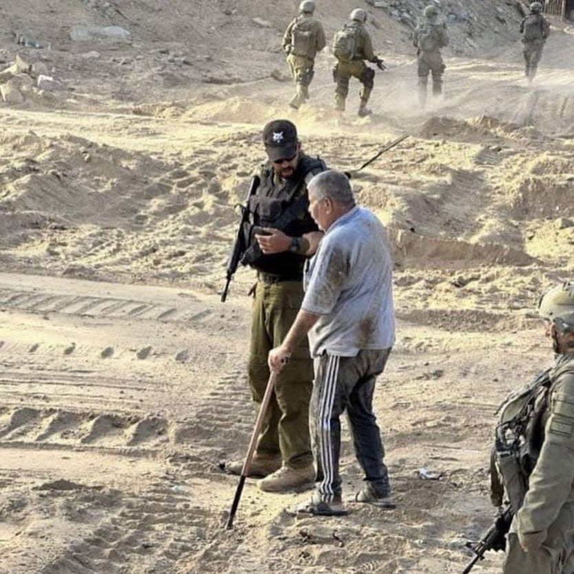 TheGlobal_in's tweet image. The Israeli soldiers took this photo, claiming that they were helping the elderly Palestinian man, then they killed him minutes later after filming was over.