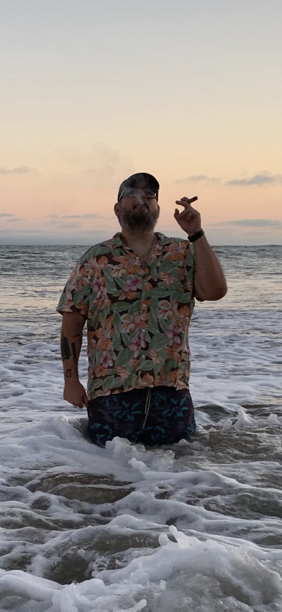 Your humble narrator smoking a Davidoff Grand Cru no 5 in the Pacific Ocean after a perfect day.