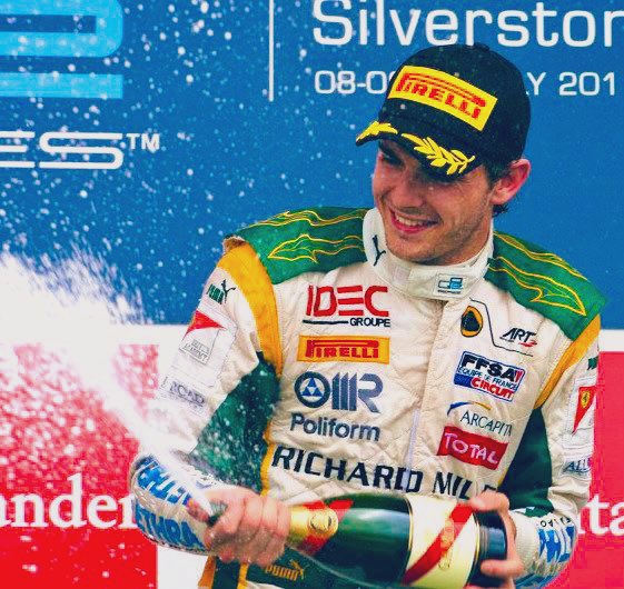 TheBishF1's tweet image. #OnThisDay 10 years ago talented young #F1 driver Jules Bianchi tragically passed away. Pic: a happy Jules celebrates victory for Lotus ART in the #GP2 feature race at Silverstone in 2011.