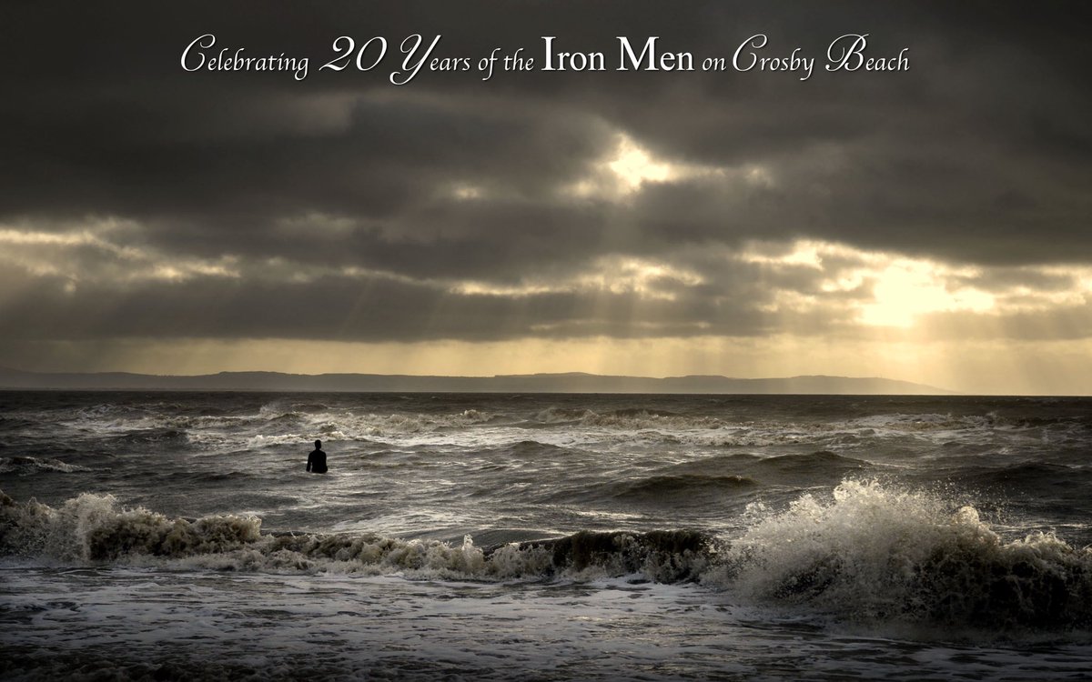 RonDaviesPhoto's tweet image. Light beams from a ragged sky, clouds torn asunder by the wind. Man’s art rises from the waters, provoking an image of primordial beauty, a turbulent scene reminiscent of creation itself. @IronMenCrosby #IronMenat20
