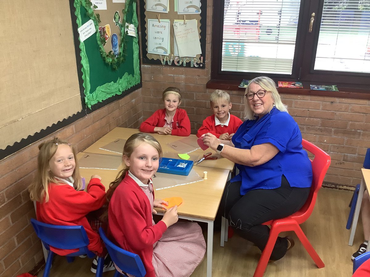 Sewing our pouches with Mrs Fahey. We are amazing designers and we hope parents will be using our product as their new purses! #acpsdt